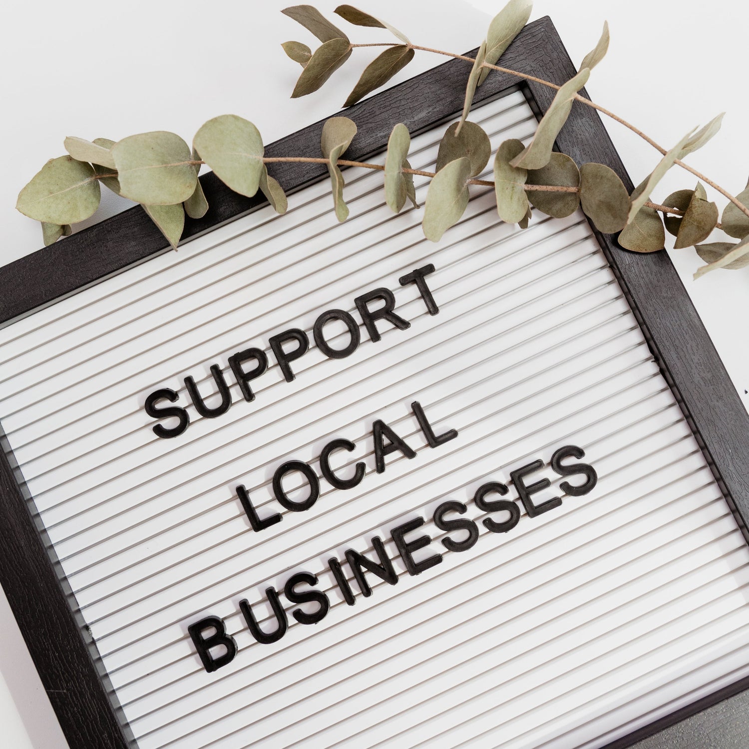 Image of sign saying support local businesses